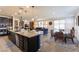 Bright, open concept living area with a kitchen island, dining space, and comfortable living room at 472 Cadence View Way, Henderson, NV 89011