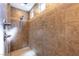 Walk-in shower features detailed tile work, neutral paint, and modern fixtures at 472 Cadence View Way, Henderson, NV 89011