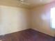 Empty bedroom with wood-look flooring and natural light, ready for personalization at 4855 S Torrey Pines Dr # 102, Las Vegas, NV 89103