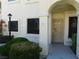 Inviting entryway featuring an arched alcove and a secure, decorative gate at 4855 S Torrey Pines Dr # 102, Las Vegas, NV 89103
