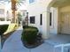 Condo exterior featuring manicured landscaping and a private entrance at 4855 S Torrey Pines Dr # 102, Las Vegas, NV 89103