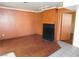 Cozy living room with a black tile fireplace and wood-look flooring at 4855 S Torrey Pines Dr # 102, Las Vegas, NV 89103