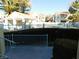 Community pool with palm trees and lush landscaping at 4855 S Torrey Pines Dr # 102, Las Vegas, NV 89103