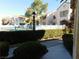 Inviting community pool surrounded by well-maintained landscaping at 4855 S Torrey Pines Dr # 102, Las Vegas, NV 89103