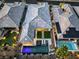 An aerial view of a modern home with a pool, landscaping and putting green at 51 Reflection Cove Dr, Henderson, NV 89011