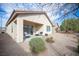 Private backyard featuring a covered patio and low-maintenance gravel landscaping at 5863 Corbin Ave, Las Vegas, NV 89122