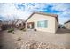 Spacious backyard with gravel landscaping, patio, and partial fencing at 5863 Corbin Ave, Las Vegas, NV 89122
