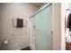 Tiled shower with glass doors in a well-lit bathroom, complete with towel rack at 5863 Corbin Ave, Las Vegas, NV 89122
