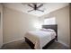 Bedroom with neutral walls, carpet flooring and bed with decorative pillows at 5863 Corbin Ave, Las Vegas, NV 89122
