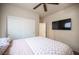 Comfortable bedroom includes a closet with sliding doors and mounted television at 5863 Corbin Ave, Las Vegas, NV 89122