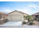 Charming single-story home with a two-car garage and well-maintained desert landscaping at 5863 Corbin Ave, Las Vegas, NV 89122