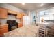 Kitchen featuring wood cabinets, granite countertops, and stainless appliances at 5863 Corbin Ave, Las Vegas, NV 89122