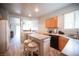 Open kitchen and dining area with natural light and modern appliances at 5863 Corbin Ave, Las Vegas, NV 89122