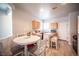 Cozy kitchen with wood cabinets, a kitchen island, and eat in kitchen table at 5863 Corbin Ave, Las Vegas, NV 89122