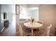 Open concept living and dining space adjacent to kitchen with seating for four at 5863 Corbin Ave, Las Vegas, NV 89122