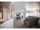 Open-concept living room featuring modern decor, gray walls, and wood-look floors at 5863 Corbin Ave, Las Vegas, NV 89122