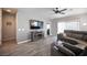 Comfortable living room with stylish furniture, ceiling fan, and sliding glass doors at 5863 Corbin Ave, Las Vegas, NV 89122