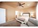 Inviting main bedroom with plush carpeting and ample natural light from large window at 5863 Corbin Ave, Las Vegas, NV 89122