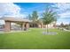 Inviting outdoor picnic area with covered seating and a lush lawn, ideal for gatherings at 5863 Corbin Ave, Las Vegas, NV 89122