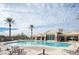 Large community pool with palm trees and lounge chairs, a great place to unwind at 5863 Corbin Ave, Las Vegas, NV 89122