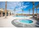 Sparkling community pool and spa surrounded by tall palm trees, perfect for relaxation at 5863 Corbin Ave, Las Vegas, NV 89122