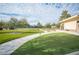 Well-maintained putting green surrounded by lush landscaping for a relaxing recreation at 5863 Corbin Ave, Las Vegas, NV 89122
