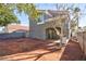 Spacious backyard featuring dirt landscaping, mature trees, and block wall at 6628 Silver Penny Ave, Las Vegas, NV 89108