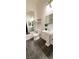 Bathroom featuring stand alone sink, pedestal sink, updated lighting and updated floors at 7858 Nookfield Dr, Las Vegas, NV 89147
