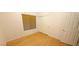 Bedroom with wood floors, blind-covered window, and a closet with sliding doors at 7858 Nookfield Dr, Las Vegas, NV 89147