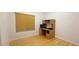 Bedroom with wood floors and a desk with overhead cabinets and drawers at 7858 Nookfield Dr, Las Vegas, NV 89147