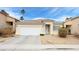 Charming single-story home featuring a well-maintained front yard and a two-car garage at 7858 Nookfield Dr, Las Vegas, NV 89147