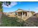 This backyard features a covered patio and grassy area at 8427 Green Mesa Ct, Las Vegas, NV 89147
