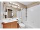 Cozy bathroom features a vanity, toilet, shower, and tub combination at 8427 Green Mesa Ct, Las Vegas, NV 89147