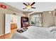 Cozy bedroom with a TV, window bench, and ensuite bath at 8427 Green Mesa Ct, Las Vegas, NV 89147