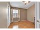 Well-lit bedroom with hardwood floors, closet, and window at 8427 Green Mesa Ct, Las Vegas, NV 89147