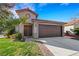 Charming single-Gathering home featuring a well-maintained front yard and a two-car garage at 8427 Green Mesa Ct, Las Vegas, NV 89147
