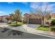 Street view of a well-maintained single-Gathering home featuring a lush lawn and two-car garage at 8427 Green Mesa Ct, Las Vegas, NV 89147