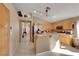 Bright kitchen features tile flooring, wood cabinets, and a breakfast bar overlooking the adjacent room at 8427 Green Mesa Ct, Las Vegas, NV 89147