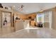 Bright kitchen features tile flooring, wood cabinets, and a breakfast bar overlooking the adjacent room at 8427 Green Mesa Ct, Las Vegas, NV 89147