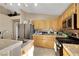 Kitchen features stainless appliances, tile countertops and backsplash, and wood cabinets at 8427 Green Mesa Ct, Las Vegas, NV 89147