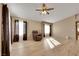 Spacious living room featuring wood flooring, and oversized windows at 8427 Green Mesa Ct, Las Vegas, NV 89147