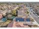 An aerial view of the neighborhood featuring a pool and solar panels on the home at 9836 La Vid Ct, Las Vegas, NV 89117