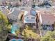 Aerial view of backyard featuring a pool, patio, and well-maintained lawn in a residential neighborhood at 9836 La Vid Ct, Las Vegas, NV 89117