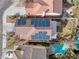 An aerial view of solar panels on the roof and backyard featuring a pool and entertainment area at 9836 La Vid Ct, Las Vegas, NV 89117