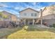 Large backyard includes a covered patio, plenty of green space, and a privacy fence at 9836 La Vid Ct, Las Vegas, NV 89117