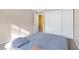 Simple bedroom with neutral walls, plush carpet and a full-size bed at 9836 La Vid Ct, Las Vegas, NV 89117
