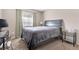 Simple bedroom with neutral walls, plush carpet, and a full-size bed at 9836 La Vid Ct, Las Vegas, NV 89117