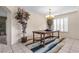 Elegant dining room with tile floors, a chandelier, and stylish decor, perfect for entertaining guests at 9836 La Vid Ct, Las Vegas, NV 89117