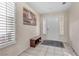 Inviting entryway featuring tile floors, natural light, and a bench for added convenience at 9836 La Vid Ct, Las Vegas, NV 89117