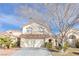 Charming two-story home with a well-manicured lawn and a spacious two car garage at 9836 La Vid Ct, Las Vegas, NV 89117